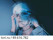 Weird dystopian theme portrait with blue neon lights. Стоковое фото, агентство Ingram Publishing / Фотобанк Лори