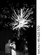 fiery pieces of a fire show against a dark sky and thunderstorms. Стоковое фото, агентство Ingram Publishing / Фотобанк Лори