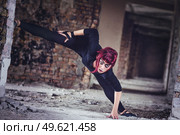 girl model in black with pink hair in an abandoned building. Стоковое фото, агентство Ingram Publishing / Фотобанк Лори