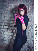 girl model in black with pink hair in an abandoned building. Стоковое фото, агентство Ingram Publishing / Фотобанк Лори