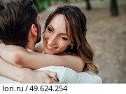 a guy and a girl are walking along the banks of a wild river overgrown with willows and forest. Стоковое фото, агентство Ingram Publishing / Фотобанк Лори