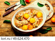 Chicken leg stuffed with mushroom and cherry plum. Baked meat dish with fruit. Chicken drumstick stuffed with plum. Стоковое фото, агентство Ingram Publishing / Фотобанк Лори