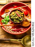 Kitchari,stewed rice with mash and spices fried in oil. Kitchari, a spicy vegetarian dish. Стоковое фото, агентство Ingram Publishing / Фотобанк Лори