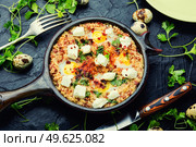 Shakshuka, Israeli cuisine,mix of tomato sauce, fried with hot peppers, spices, minced meat and eggs.Scrambled eggs. Israeli shakshuka, arabic cuisine. Стоковое фото, агентство Ingram Publishing / Фотобанк Лори