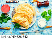 Cheburek, a dish of unleavened dough stuffed with minced meat. Fried pies. Traditional homemade pasties, cheburek. Стоковое фото, агентство Ingram Publishing / Фотобанк Лори