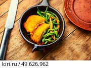 Chicken cutlet with a garnish from asparagus beans and carrots. Ukrainian traditional food. Chicken cutlets and vegetable garnish. Стоковое фото, агентство Ingram Publishing / Фотобанк Лори