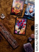 typical lenormand spelling  cards by  with gemstones. hobby and life style concept. Редакционное фото, агентство Ingram Publishing / Фотобанк Лори