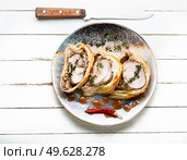 Juicy meat in a dough with spices, mushroom or vegetable pate. Wellington meat.. Wellington meat is a festive tenderloin dish. Стоковое фото, агентство Ingram Publishing / Фотобанк Лори