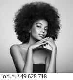 Beautiful smiling girl with curly hairstyle stock photo Women, African Ethnicity, Fashion Model, One Woman Only. Black and white photo. Стоковое фото, агентство Ingram Publishing / Фотобанк Лори