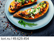 Sweet potato filled vegetables and cottage cheese and baked in halves. Homemade diet food, roast yam. Sweet potato stuffed with vegetables and cottage cheese. Стоковое фото, агентство Ingram Publishing / Фотобанк Лори