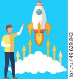 Man launches aircraft into space. Rocket takes off and leaves cloud. Guy is indicating direction of flight. Rocket flies into sky and releases fire. Male character watching launch vector illustration. Man launches aircraft into space. Rocket takes off. Guy is indicating direction of flight. Стоковая иллюстрация, агентство Ingram Publishing / Фотобанк Лори