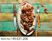 Spicy vindaloo meat with rice. Pork cooked in spicy garlic sauce. Vindaloo, meat in roast spices. Стоковое фото, агентство Ingram Publishing / Фотобанк Лори