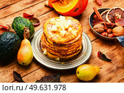 Stack delicious pancakes on the table with fruits.. Appetizing homemade pancakes, fritter. Стоковое фото, агентство Ingram Publishing / Фотобанк Лори