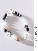 jewel handmade bracelet with semipreciouse stones at white  background. Стоковое фото, агентство Ingram Publishing / Фотобанк Лори