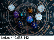 Horoscope zodiac circle with divination dice. Fortune telling and astrology predictions charts concept, magic rituals and exoteric experience. Zodiac horoscope with divination dice. Стоковое фото, агентство Ingram Publishing / Фотобанк Лори