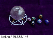Magic crystal ball and divination dice. Fortune telling, numerology and astrology predictions concept. Crystal ball and divination dice. Стоковое фото, агентство Ingram Publishing / Фотобанк Лори