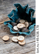 Handmade runes for fortunetelling in leather bag. Handmade runes for fortunetelling. Стоковое фото, агентство Ingram Publishing / Фотобанк Лори