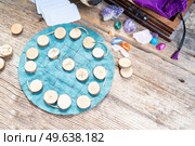 Handmade runes for fortunetelling over leather chart, magic rituals lifestyle. Handmade runes for fortunetelling. Стоковое фото, агентство Ingram Publishing / Фотобанк Лори