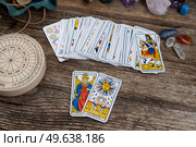 Fortune telling on tarot cards, used Marseille Tarot deck by unknown artist published first in 1709. Fortune telling on tarot cards. Стоковое фото, агентство Ingram Publishing / Фотобанк Лори