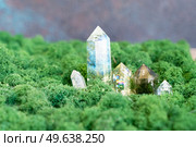 gemstones minerals on mysterious natural forest moss background, quartz and calcite crystals close up. Magic healing Rock for Reiki Crystal Ritual, Witchcraft, spiritual esoteric practice. Healing crystals on brown background. Стоковое фото, агентство Ingram Publishing / Фотобанк Лори