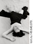 girl in a black long dress in a sandy desert under a blue sky. Стоковое фото, агентство Ingram Publishing / Фотобанк Лори