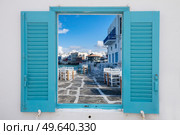 windows with seaside cafe at Little venice district of Mykonos island, Greece with sunshine. Mykonos island, Greece. Стоковое фото, агентство Ingram Publishing / Фотобанк Лори