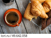 coffee with french baget and croissants on provence style old wooden table. flat lay. Стоковое фото, агентство Ingram Publishing / Фотобанк Лори