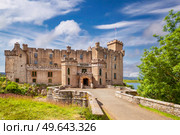 Dunvegan castle on the Isle of Skye - the seat of the MacLeod of MacLeod, Scotland. Dunvegan castle on the Isle of Skye, Scotland. Стоковое фото, агентство Ingram Publishing / Фотобанк Лори