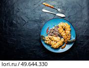 Fried sea bass fish with rice on rice paper. Copy space. Appetizing fried sea bass fish, seafood. Стоковое фото, агентство Ingram Publishing / Фотобанк Лори