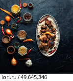 Spicy vindaloo meat with rice. Pork cooked in spicy garlic sauce. Vindaloo, meat in fried spices. Стоковое фото, агентство Ingram Publishing / Фотобанк Лори