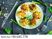 Vegan cutlets or fritter from zucchini, oatmeal and greens.. Diet zucchini rissole. Стоковое фото, агентство Ingram Publishing / Фотобанк Лори