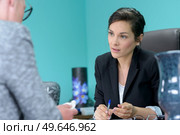 funeral worker talking to sad woman. Стоковое фото, агентство Ingram Publishing / Фотобанк Лори