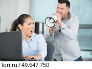 man with megaphone and woman. Стоковое фото, агентство Ingram Publishing / Фотобанк Лори