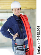 a female worker during an insulation work. Стоковое фото, агентство Ingram Publishing / Фотобанк Лори