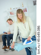 Woman doing some ironing. Стоковое фото, агентство Ingram Publishing / Фотобанк Лори