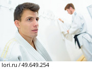 young men in martial arts uniform. Стоковое фото, агентство Ingram Publishing / Фотобанк Лори
