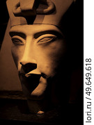 bust of pharaoh Echnaton (Akhenaten, aka Amenhotep IV) around black background . cloes up. Стоковое фото, агентство Ingram Publishing / Фотобанк Лори