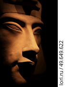 bust of pharaoh Echnaton (Akhenaten, aka Amenhotep IV) around black background . cloes up. Стоковое фото, агентство Ingram Publishing / Фотобанк Лори