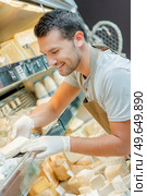 male worker chiller of cheese. Стоковое фото, агентство Ingram Publishing / Фотобанк Лори