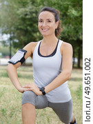 fitness woman stretching legs in the park. Стоковое фото, агентство Ingram Publishing / Фотобанк Лори
