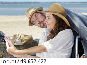 couple in wheelchair taking a wacky selfie tongue out. Стоковое фото, агентство Ingram Publishing / Фотобанк Лори