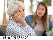 loving adult daughter talking to sad old mother. Стоковое фото, агентство Ingram Publishing / Фотобанк Лори