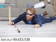 blind man fallen on the floor in his home. Стоковое фото, агентство Ingram Publishing / Фотобанк Лори
