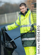 young waste collector at work. Стоковое фото, агентство Ingram Publishing / Фотобанк Лори
