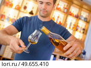 a man and an amount of alcohol. Стоковое фото, агентство Ingram Publishing / Фотобанк Лори