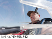 middle-aged man in cockpit of sailplane. Стоковое фото, агентство Ingram Publishing / Фотобанк Лори