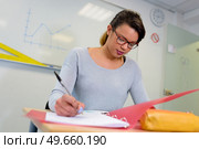 class teacher preparing her lessons. Стоковое фото, агентство Ingram Publishing / Фотобанк Лори