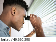 suspicious skeptic and confused man with binoculars. Стоковое фото, агентство Ingram Publishing / Фотобанк Лори