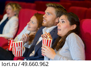 couple at the cinema watching an horror movie. Стоковое фото, агентство Ingram Publishing / Фотобанк Лори