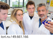 student and teacher with bluish result. Стоковое фото, агентство Ingram Publishing / Фотобанк Лори